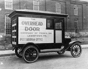 historical-photo-of-overhead-garage-door-repair-truck-in-1920s